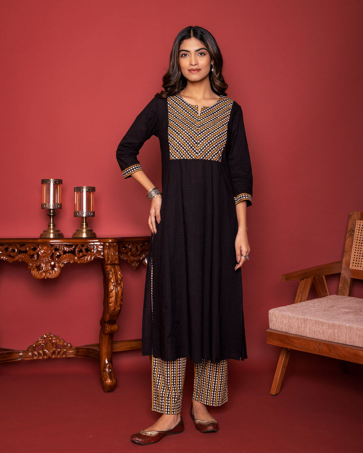 BLACK COTTON ROUND WITH V-NECK HAND BLOCK KATHA WORK AND SEQUENCE KURTA PANT SET