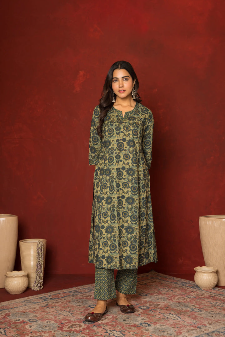 GREEN COTTON ROUND WITH V-CUT BOOTI HIGHLIGHTED WITH HAND KATHA KURTA PANT SET