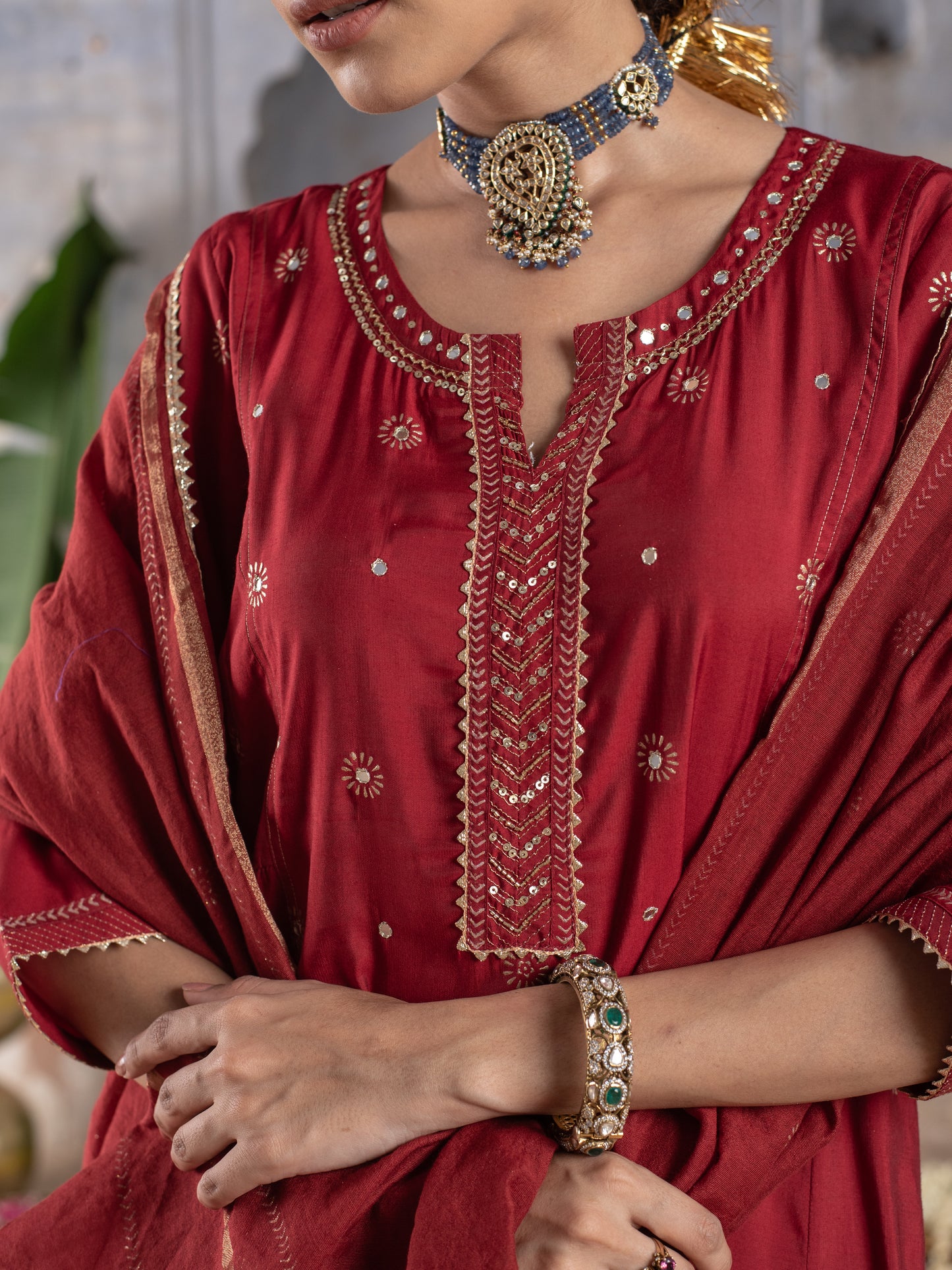 RED CHANDERI ROUND WITH V-CUT NECKLINE HIGHLIGHTED WITH ZARI LINES AND MIRROR WORK WITH GOTA DORIYA DUPATTA