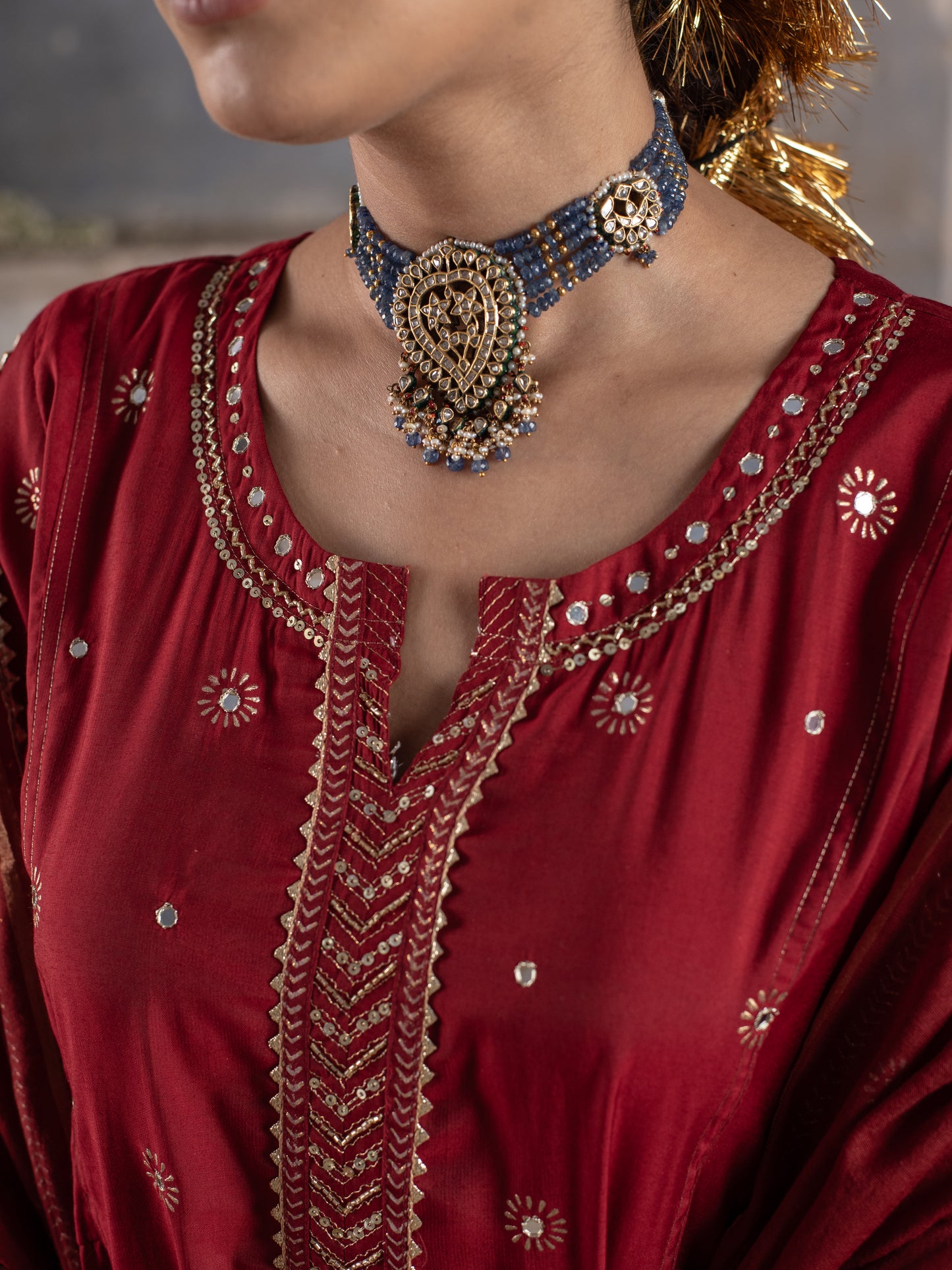 RED CHANDERI ROUND WITH V-CUT NECKLINE HIGHLIGHTED WITH ZARI LINES AND MIRROR WORK WITH GOTA DORIYA DUPATTA