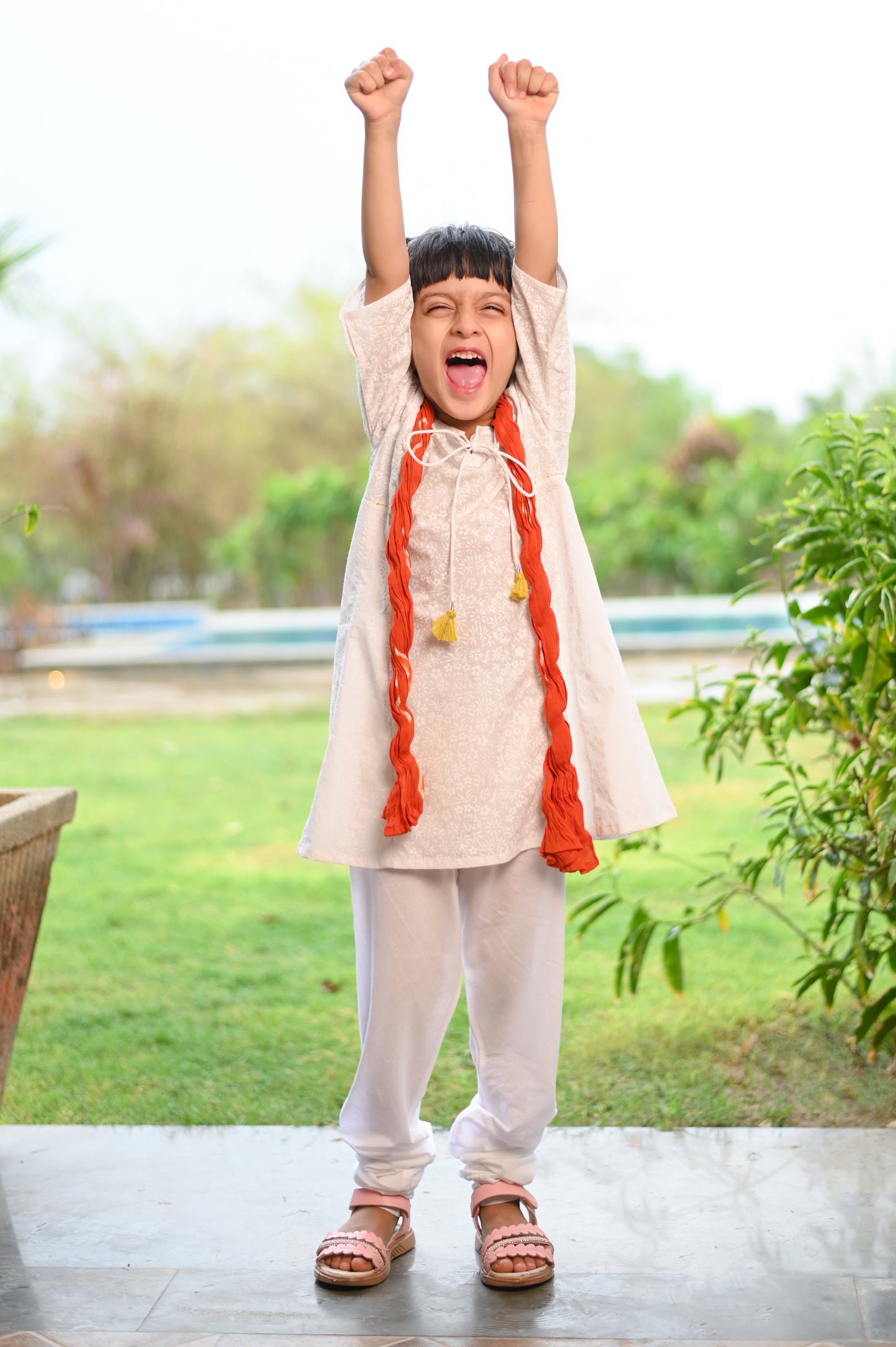 White Kurta with Chudidar Pajama and Orange Dupatta