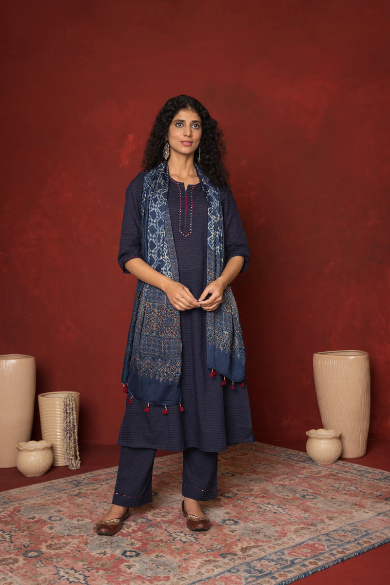 INDIGO BLUE COTTON DOBBY ROUND KURTA HIGHLIGHTED WITH HAND KATHA AND SEQUENCE WORK KURTA PANT SET