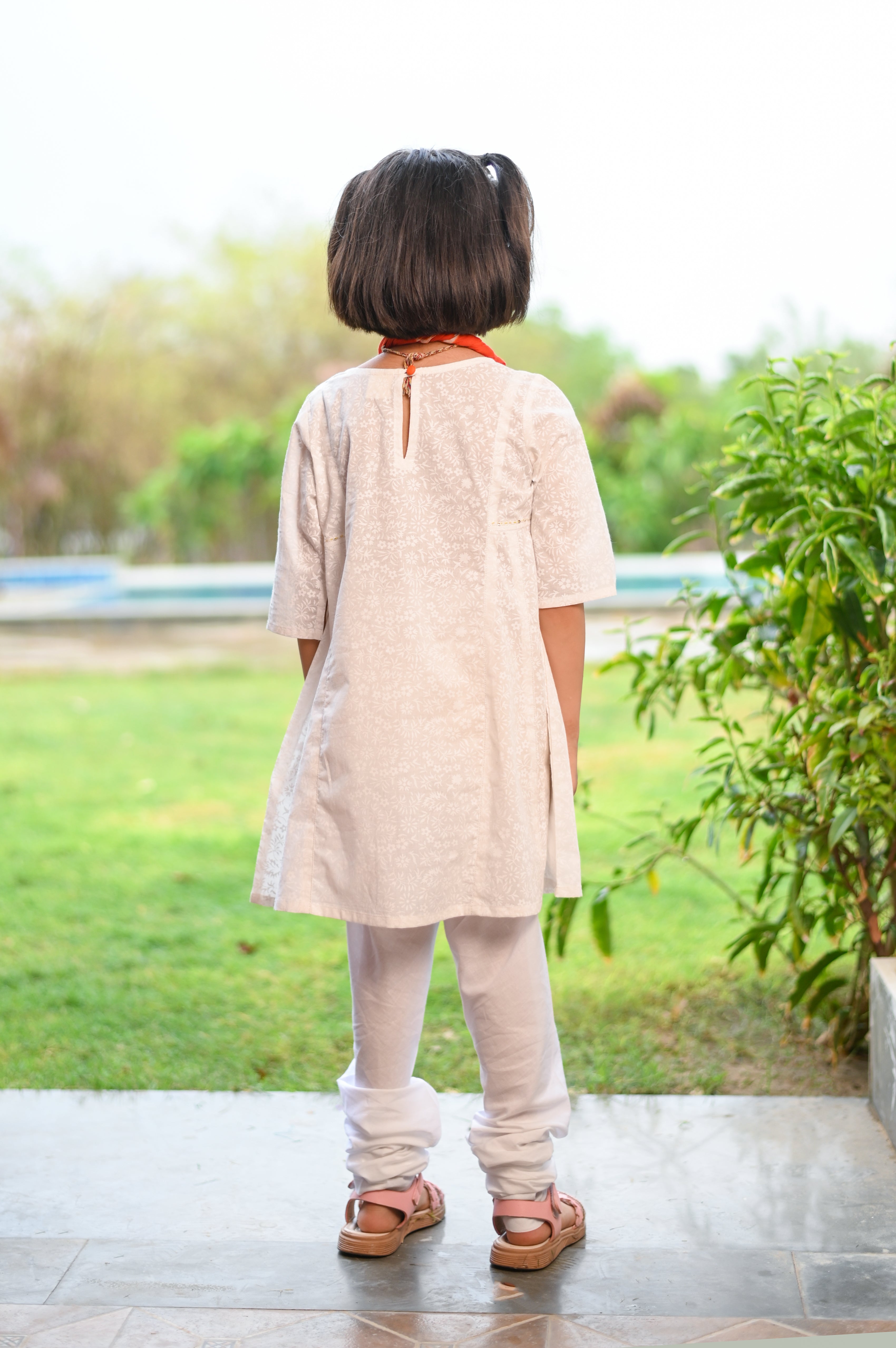 White Kurta with Chudidar Pajama and Orange Dupatta